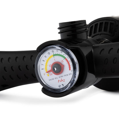 Black pressure gauge with a white face on a white background