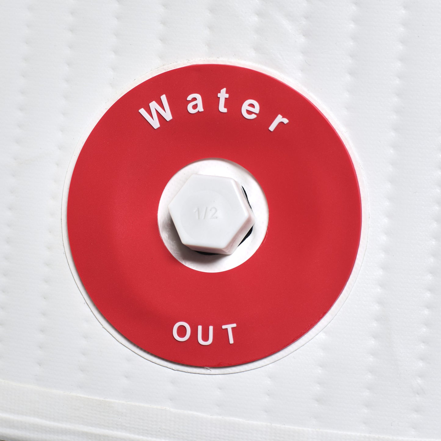 Red valve cover with 'Water Out' text on a white background