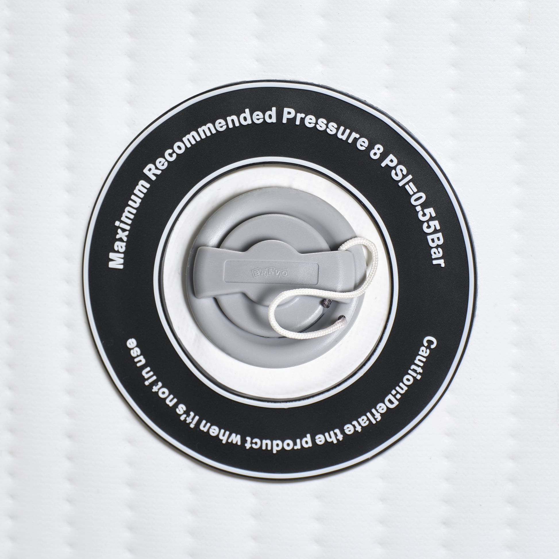 Close-up of a pressure valve with text on a white background