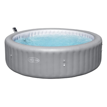 Inflatable hot tub with water on a white background, featuring the Lay-Z-Spa brand.