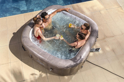 People enjoying a hot tub by a poolside