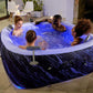 People enjoying a hot tub in a modern indoor setting with decorative elements.