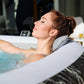 Woman relaxing in a hot tub outdoors