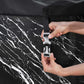Person securing a strap on a black and white marble-patterned cover with 'E-SPA' branding.