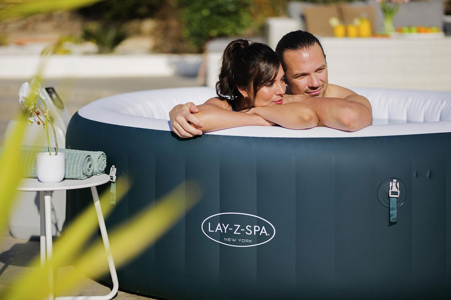 Two people in a Lay-Z-Spa hot tub outdoors