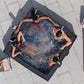 People relaxing in a hot tub on a patio with a table and fruit bowl nearby.