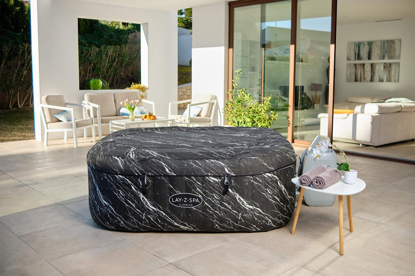Inflatable hot tub with marble pattern in a modern outdoor setting