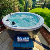 H2O 1000 Series hot tub in garden setting
